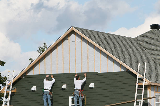 Professional Siding Replacement technician working in New Smyrna Beach, FL
